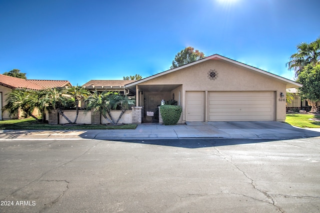 ranch-style house featuring a garage