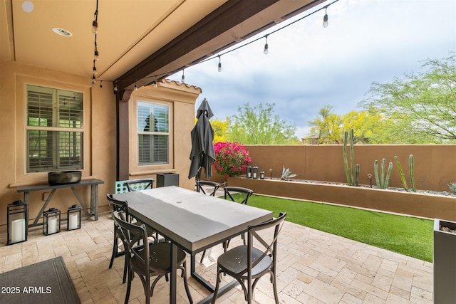 view of patio / terrace with fence and outdoor dining space