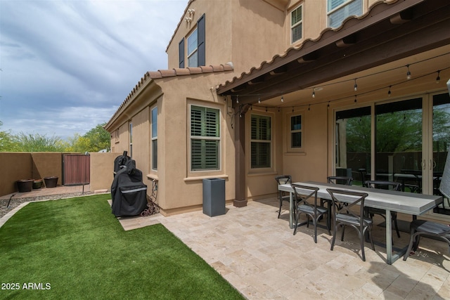 view of patio featuring a gate and fence