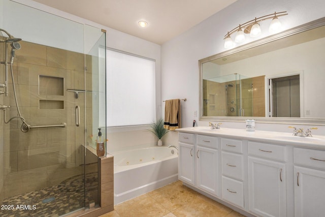 bathroom with tile patterned flooring, vanity, and shower with separate bathtub