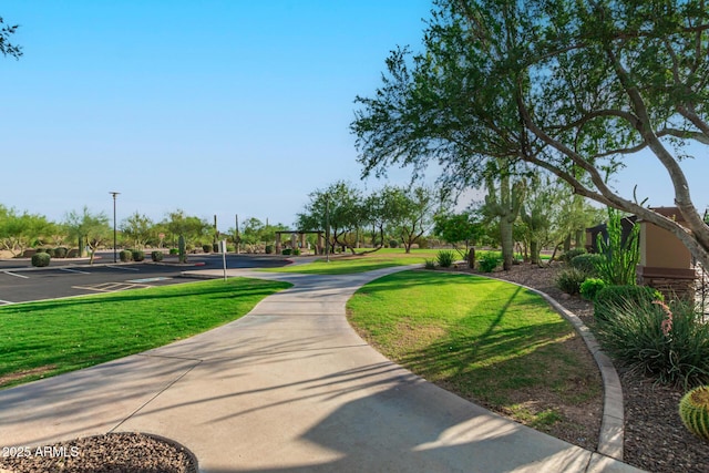 view of home's community featuring a lawn