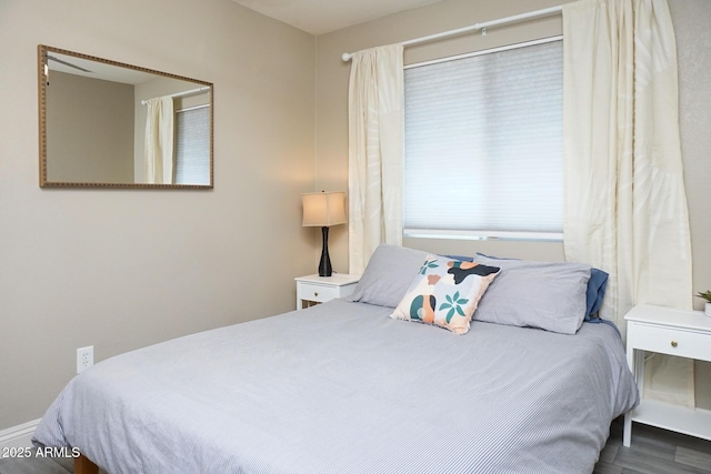 bedroom featuring dark wood-type flooring