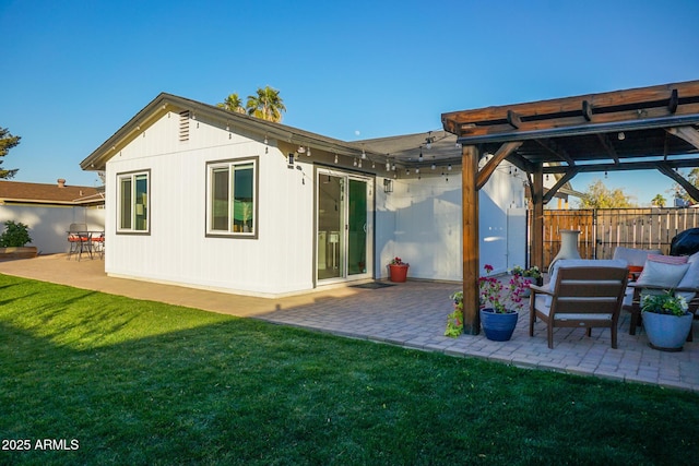 back of house featuring a patio and a yard