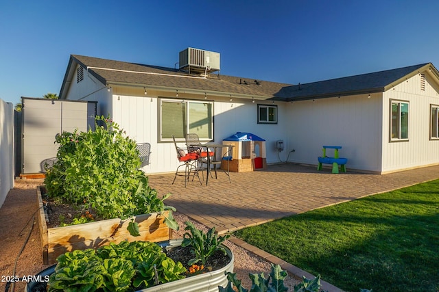 back of house with a yard, a patio, and cooling unit