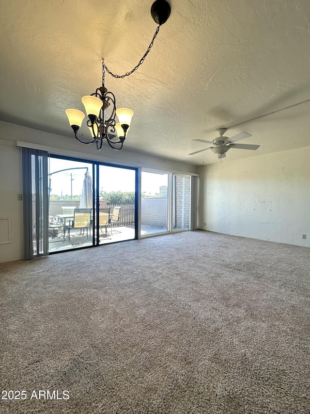 3340 W State Route 89a Unit 9, Sedona, AZ 86336 - carpeted spare room with a textured ceiling, a chandelier, and a ceiling fan