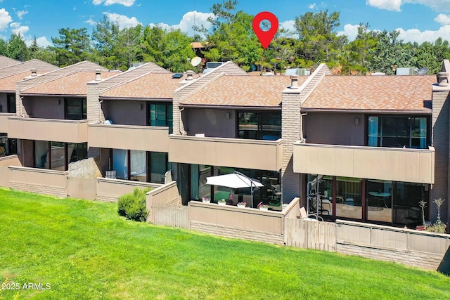 3340 W State Route 89a Unit 9, Sedona, AZ 86336 - rear view of house featuring a lawn and a shingled roof