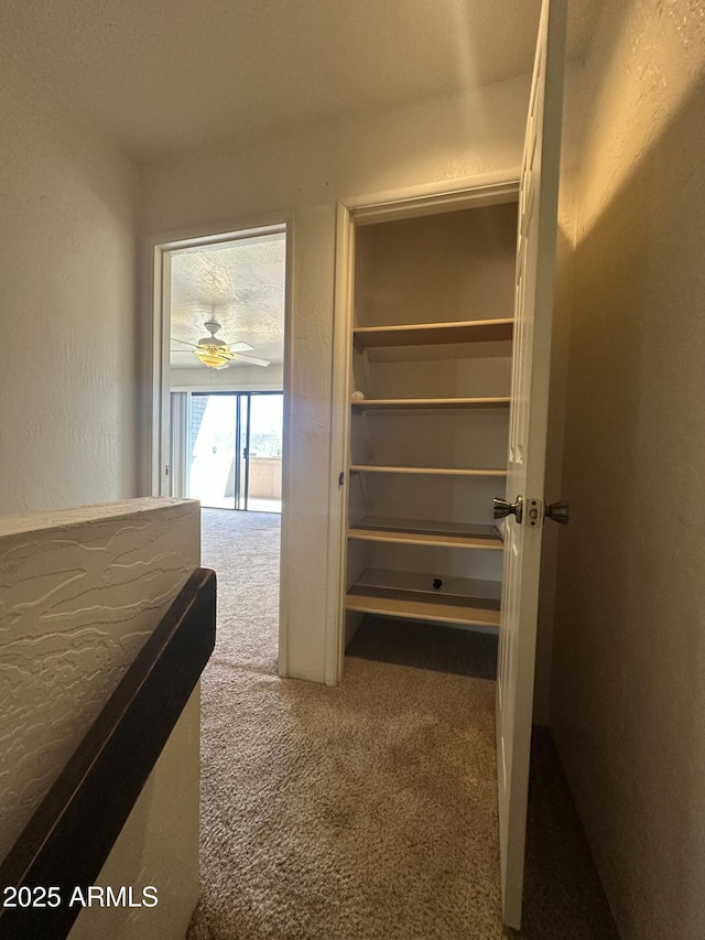 3340 W State Route 89a Unit 9, Sedona, AZ 86336 - bedroom featuring carpet, a textured wall, and access to exterior