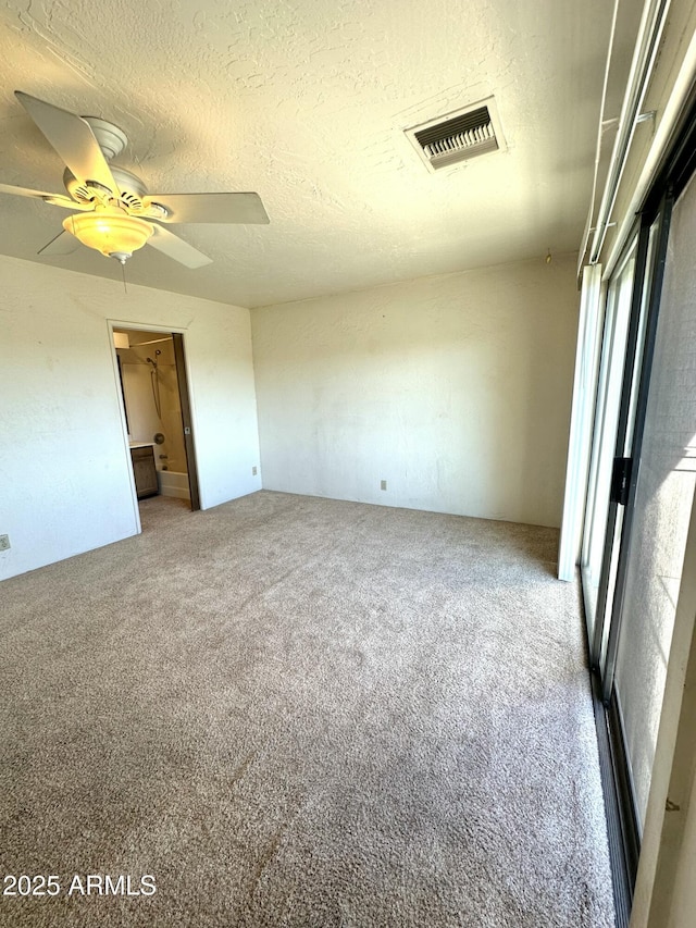 3340 W State Route 89a Unit 9, Sedona, AZ 86336 - carpeted empty room with ceiling fan and a textured ceiling