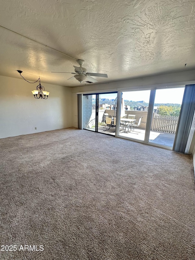 3340 W State Route 89a Unit 9, Sedona, AZ 86336 - unfurnished room featuring a textured ceiling, carpet, a chandelier, and ceiling fan