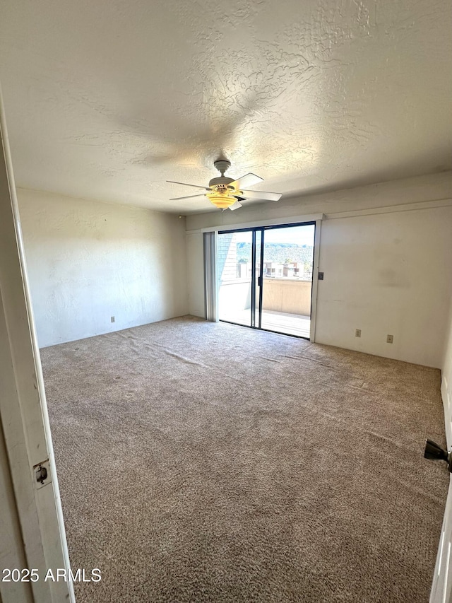 3340 W State Route 89a Unit 9, Sedona, AZ 86336 - carpeted spare room with a ceiling fan and a textured ceiling