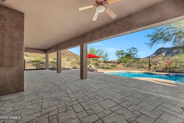 13945 E Gail Rd, Scottsdale, AZ 85259 - view of pool featuring a mountain view, a patio area, ceiling fan, and a fenced backyard