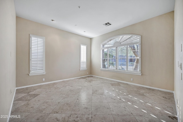 13945 E Gail Rd, Scottsdale, AZ 85259 - tiled empty room featuring baseboards