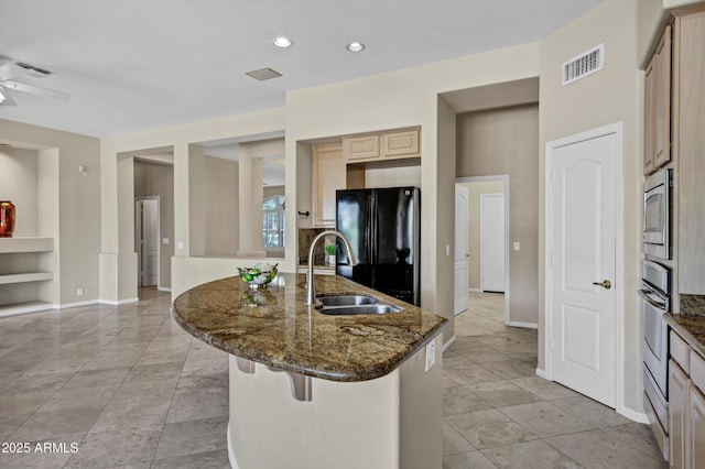 13945 E Gail Rd, Scottsdale, AZ 85259 - kitchen featuring stainless steel appliances, a breakfast bar area, dark stone counters, recessed lighting, and light brown cabinetry