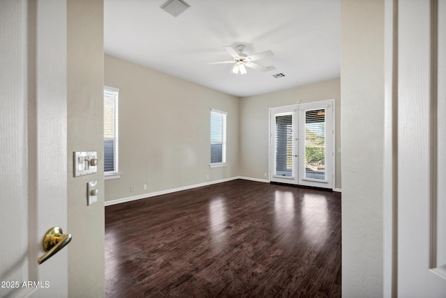 13945 E Gail Rd, Scottsdale, AZ 85259 - unfurnished room featuring a ceiling fan and dark wood-style flooring