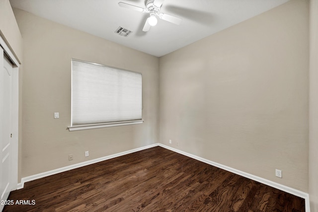 13945 E Gail Rd, Scottsdale, AZ 85259 - unfurnished bedroom with a closet, dark wood-type flooring, and ceiling fan