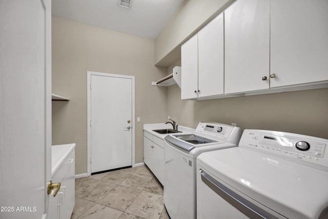 13945 E Gail Rd, Scottsdale, AZ 85259 - washroom with washer and clothes dryer and cabinet space