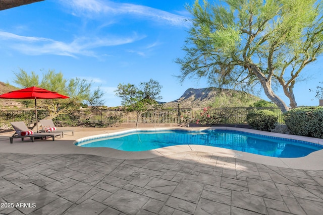 13945 E Gail Rd, Scottsdale, AZ 85259 - view of swimming pool featuring a mountain view, a fenced backyard, and a patio