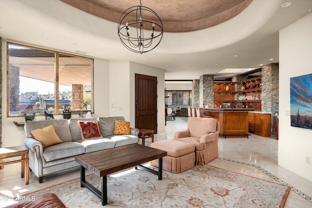 11070 E Rolling Rock Dr, Scottsdale, AZ 85262 - living room with a tray ceiling, an inviting chandelier, and bar