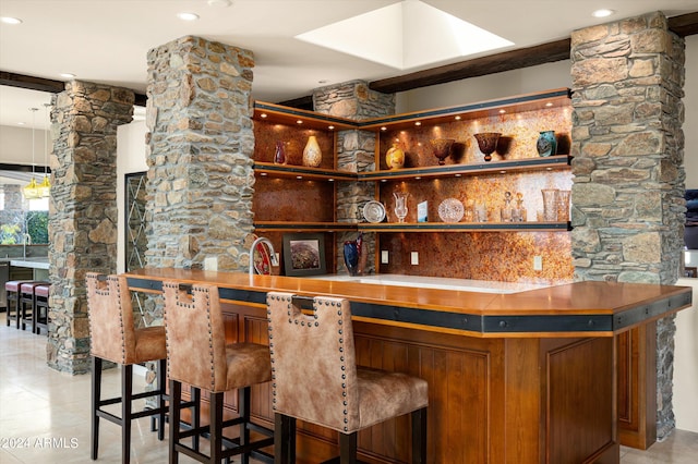 11070 E Rolling Rock Dr, Scottsdale, AZ 85262 - bar with decorative columns, bar area, and light tile patterned floors