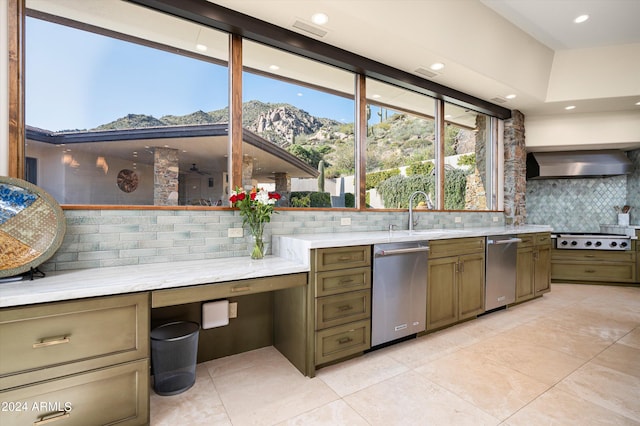11070 E Rolling Rock Dr, Scottsdale, AZ 85262 - kitchen featuring light countertops, gas stovetop, wall chimney exhaust hood, a sink, and backsplash