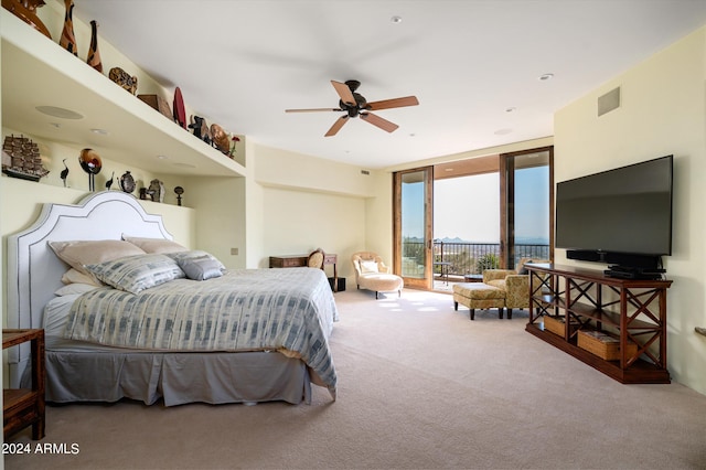 11070 E Rolling Rock Dr, Scottsdale, AZ 85262 - carpeted bedroom featuring access to exterior, visible vents, ceiling fan, and a wall of windows