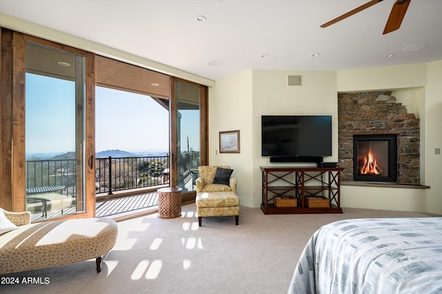11070 E Rolling Rock Dr, Scottsdale, AZ 85262 - bedroom with carpet flooring, floor to ceiling windows, access to exterior, visible vents, and a fireplace