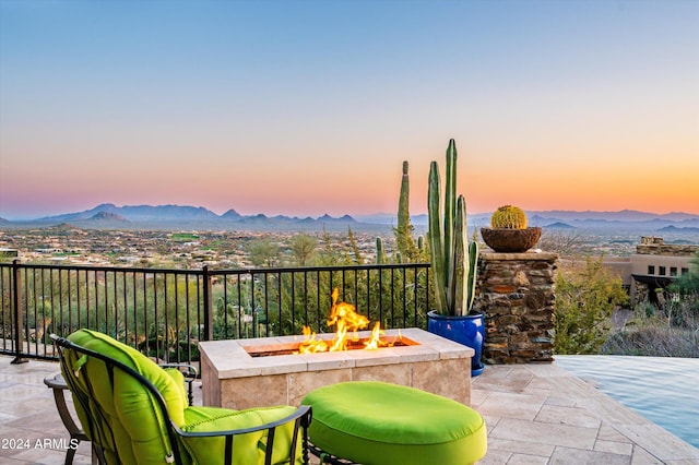 11070 E Rolling Rock Dr, Scottsdale, AZ 85262 - view of patio with a fire pit and a mountain view
