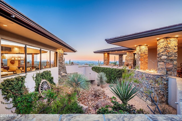 11070 E Rolling Rock Dr, Scottsdale, AZ 85262 - view of side of home featuring stone siding