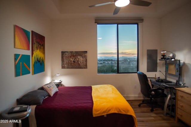 bedroom with hardwood / wood-style flooring and ceiling fan