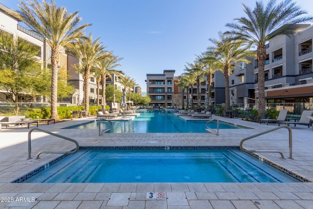 view of swimming pool with a patio