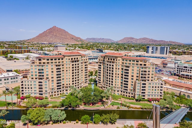 view of building exterior featuring a water and mountain view