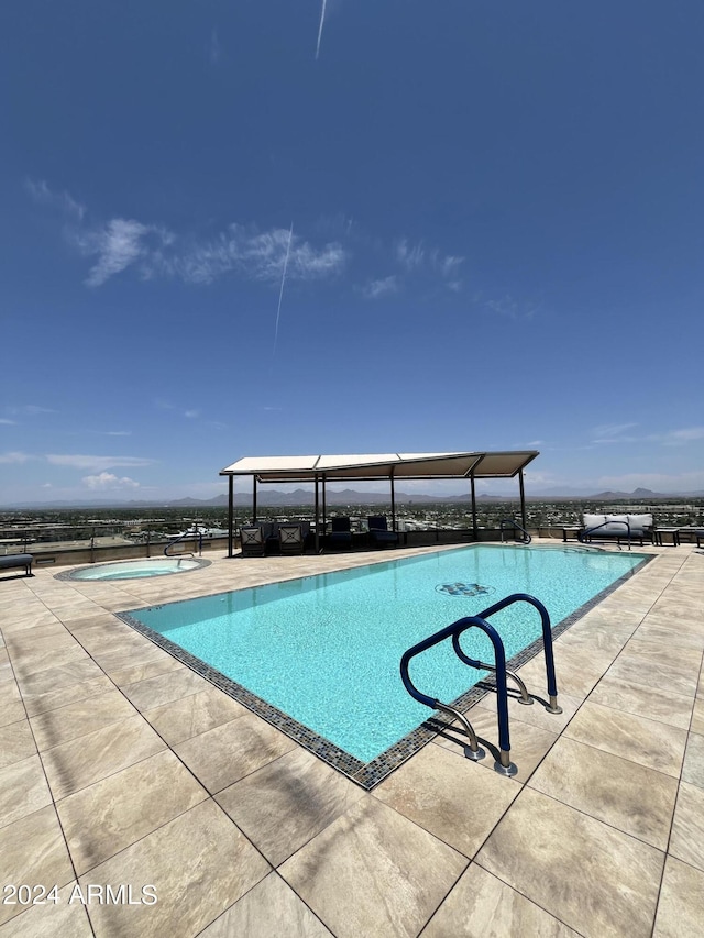 view of swimming pool featuring a patio