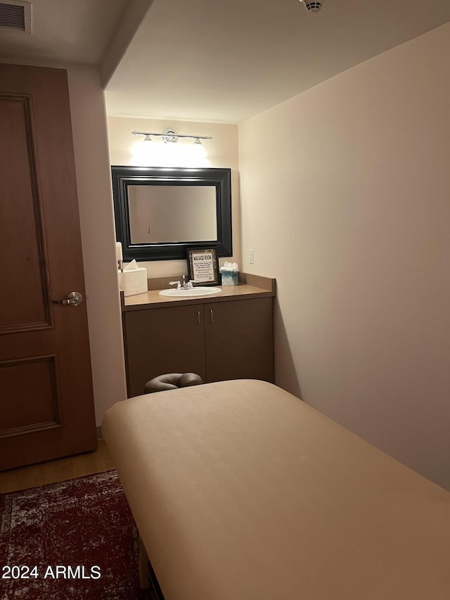 bathroom featuring vanity and hardwood / wood-style flooring