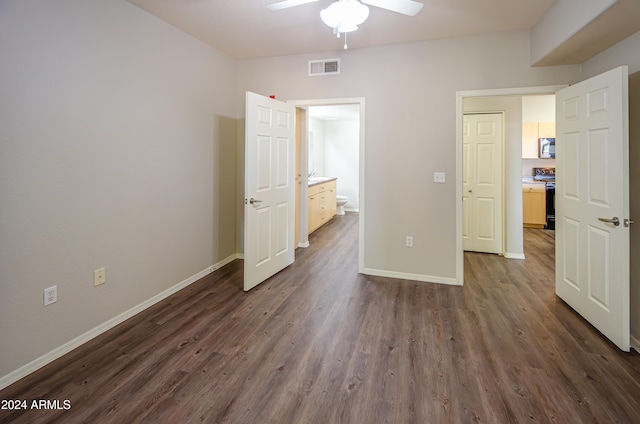 unfurnished bedroom featuring dark hardwood / wood-style floors and ceiling fan