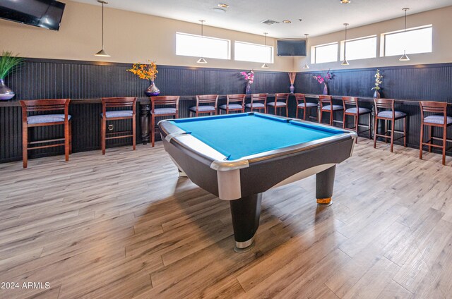 rec room featuring billiards, wooden walls, and light hardwood / wood-style flooring