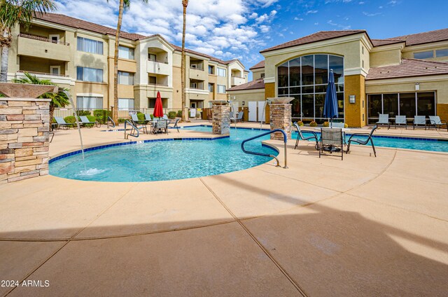 view of pool featuring a patio and pool water feature