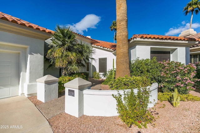 view of side of property with a garage