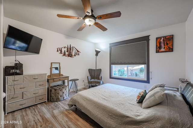 bedroom featuring ceiling fan and light hardwood / wood-style floors