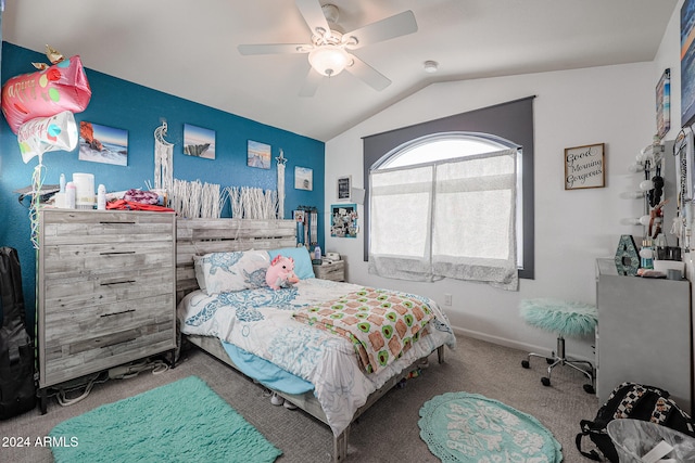 carpeted bedroom with ceiling fan and vaulted ceiling