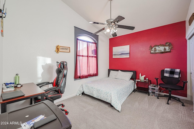 carpeted bedroom with ceiling fan and lofted ceiling