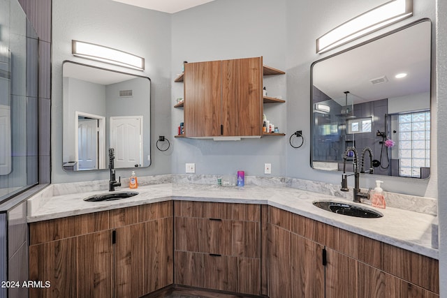 kitchen featuring light stone counters and sink