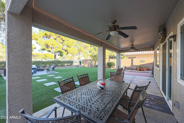 view of patio featuring ceiling fan