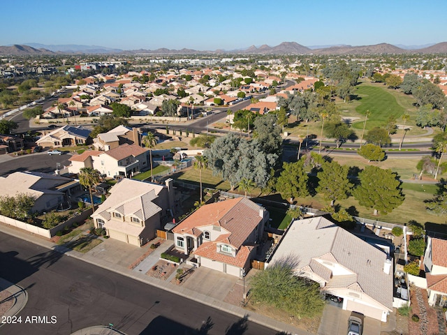 birds eye view of property with a mountain view