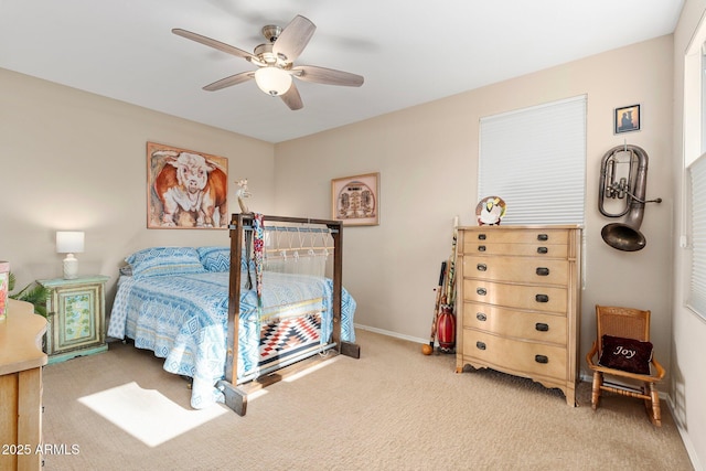 bedroom featuring ceiling fan and carpet