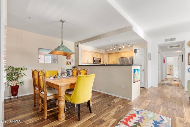 dining room featuring dark hardwood / wood-style floors