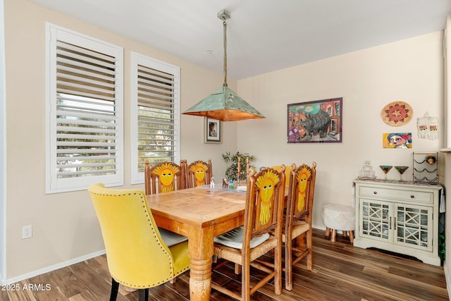 dining space featuring dark hardwood / wood-style floors