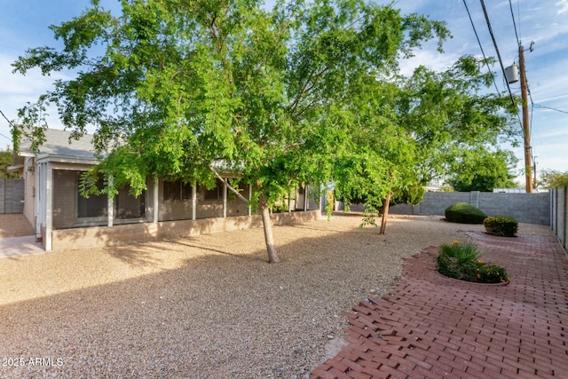 view of yard with a fenced backyard and a patio area