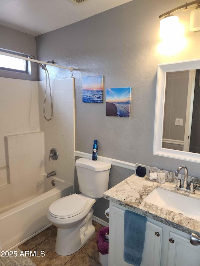 full bath featuring toilet, vanity, washtub / shower combination, and tile patterned floors