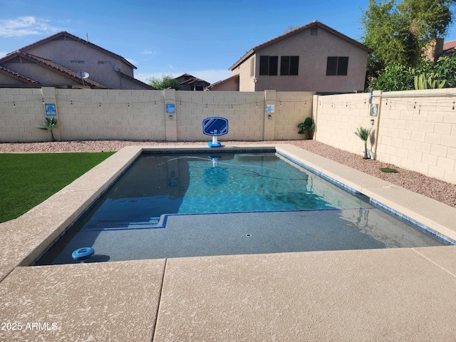 view of pool featuring a fenced backyard