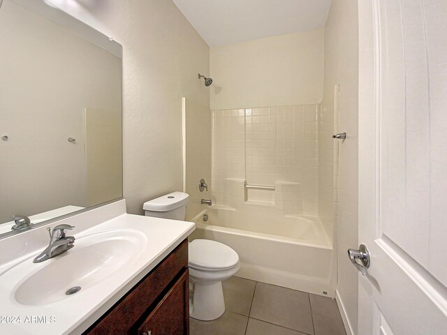 bathroom featuring tile patterned flooring, shower / bathing tub combination, vanity, and toilet